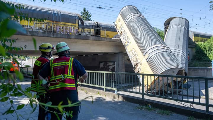 1 killed as freight train plunges from bridge in Germany after crash