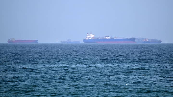 Iran warns ships not to bypass its chosen Hormuz route as interim deal tested