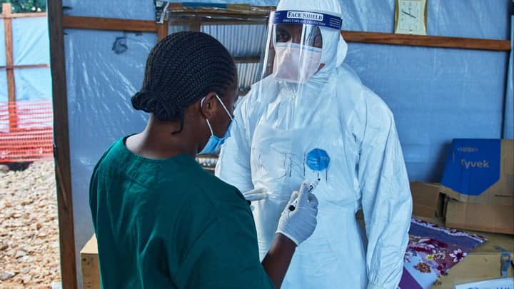 Ebola treatment trial begins in Congo as citizens mourn hundreds