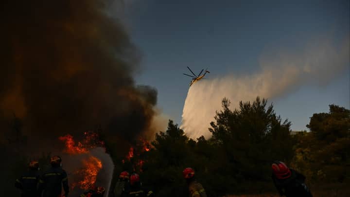 Greece firefighting helicopters collide as battle to contain wildfires continues