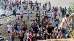 About 60,000 migrants arrive in Ceuta in 24 hours, Spanish territory's leader says