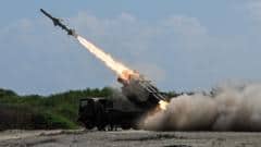 Japan defence minister denies militarism and criticises China's 'huge arsenal'
