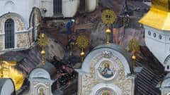 Russian strikes kill 11 and set historic cathedral in Kyiv ablaze