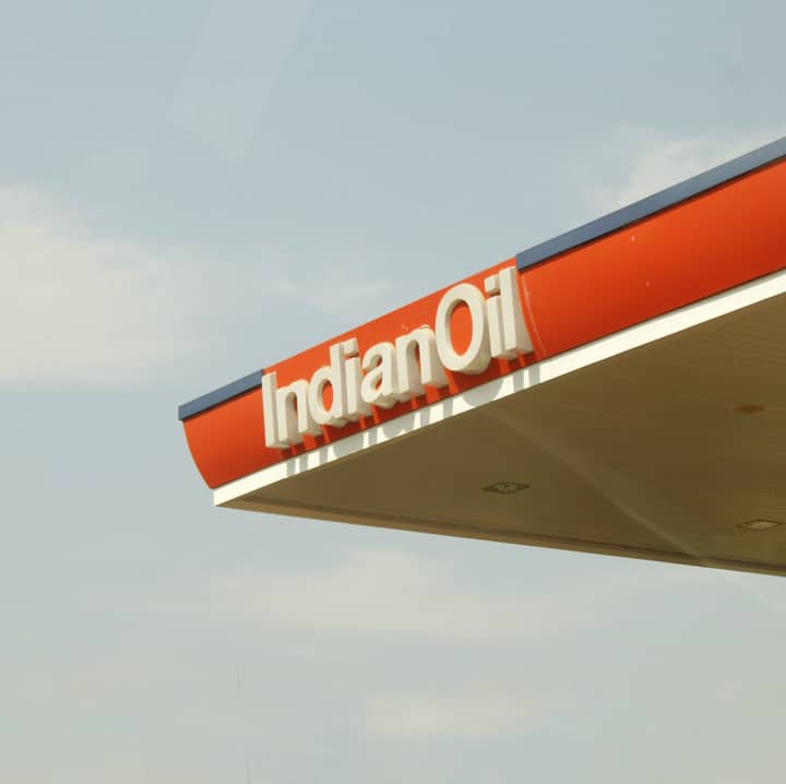 Close-up view of Indian Oil Corporation's petrol station canopy against clear sky.