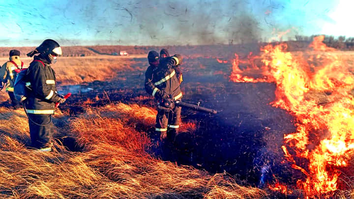 Brave firefighters battling a vast wildfire in the fields of Amur Oblast, Russia