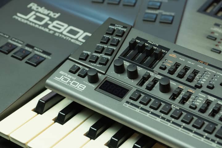 Detailed view of a Roland JD-800 synthesizer showing control knobs and keyboard.