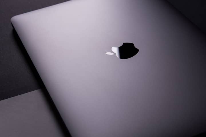 Close-up of a sleek, modern laptop featuring a minimalist design on a dark surface.