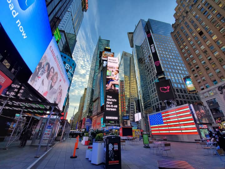 Colorful and lively atmosphere of Times Square in New York during the day.
