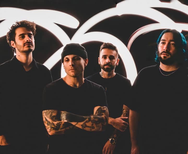Dynamic portrait of a diverse rock band with neon lighting in an Orlando studio.