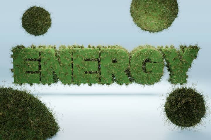3D render of the word 'ENERGY' covered in grass, symbolizing green energy and sustainability.
