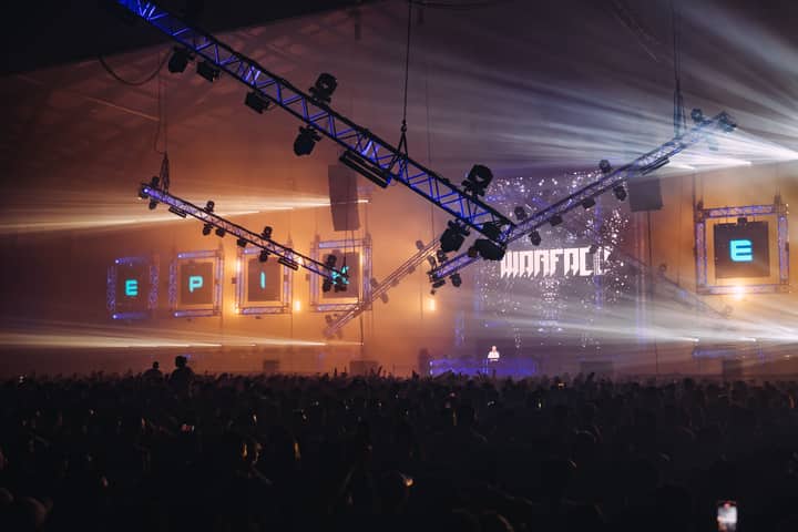 Vibrant concert with crowd in Sydney, capturing live music energy and dynamic lighting.