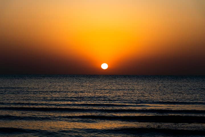Stunning sunset view over the Caspian Sea, capturing serene waves and golden hues.