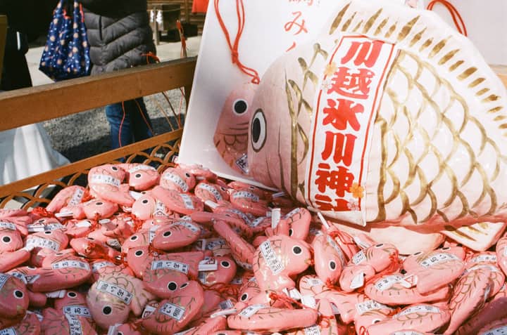 Vibrant fish charms on display at a Tokyo market capture Japanese cultural essence.