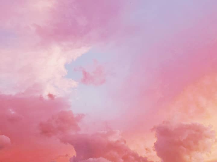 Vibrant pink and orange clouds during a breathtaking sunset sky.