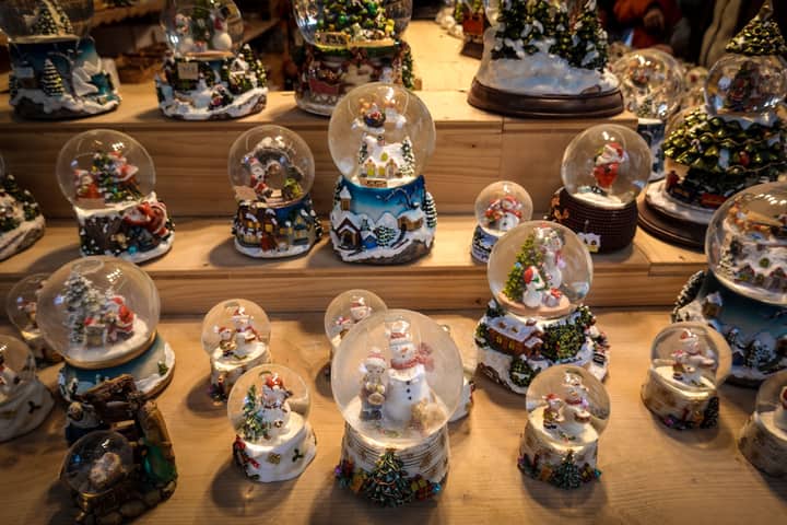 A collection of festive snow globes on display, perfect for holiday decorations and winter celebrations.