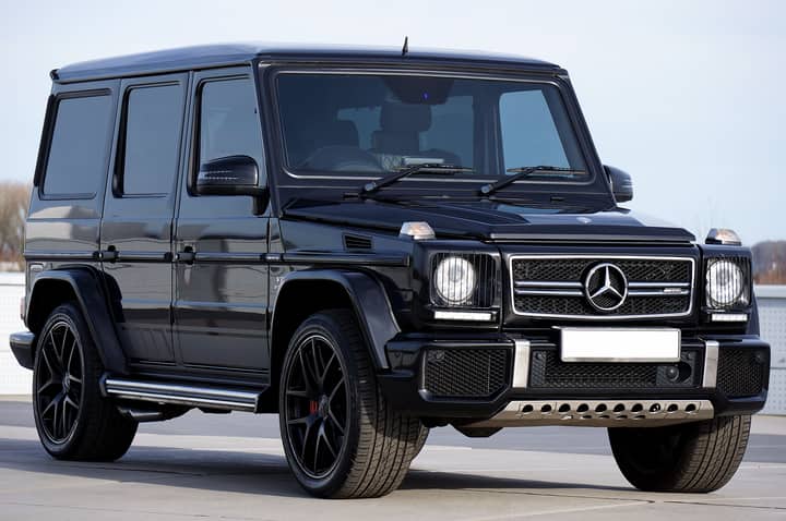 Sleek black Mercedes G-Class SUV parked outdoors, showcasing luxury design and power.