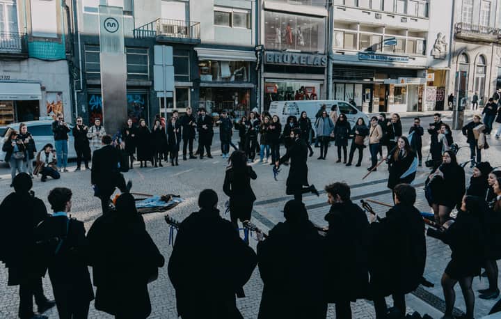 A vibrant street music performance in Oporto, Portugal, captivating passerby.