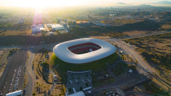 Captivating aerial shot of Estadio Akron in Zapopan, Mexico during sunset.