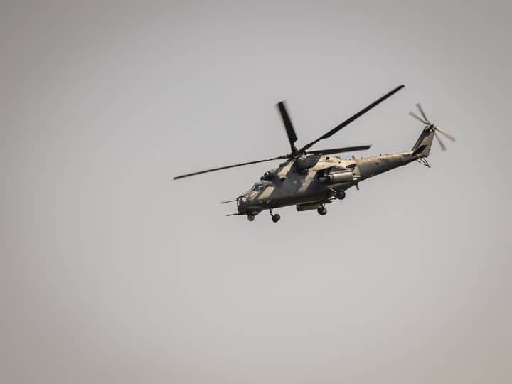 A military helicopter flying through the sky in Serbia, showcasing aviation power.
