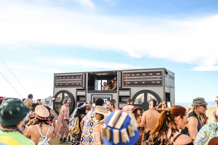 Lively outdoor music festival in Cape Town with a large crowd and unique decor.