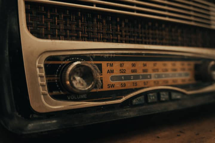 Detailed close-up of a vintage radio dial with nostalgic elements and textured design.
