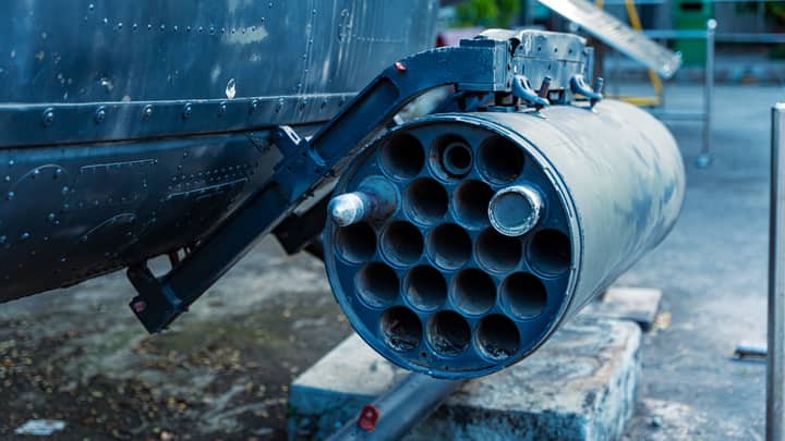 Detailed view of a military rocket launcher showcased outdoors, showcasing industrial design.