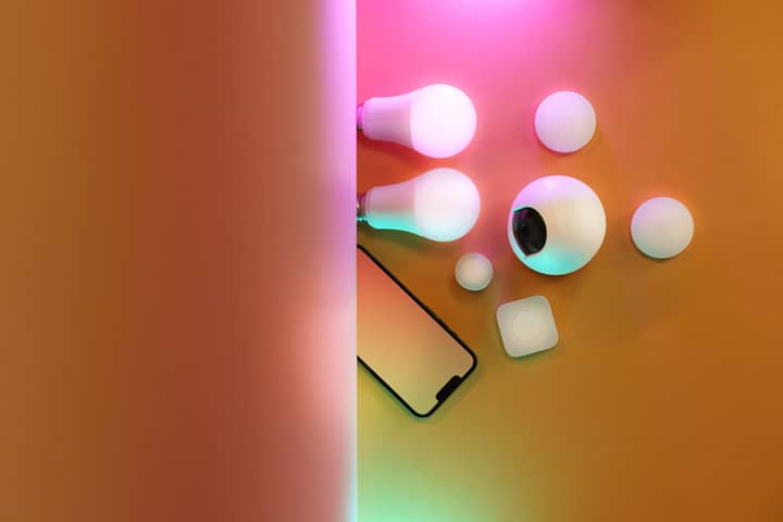 A flat lay of smart bulbs and devices, creating a vibrant tech ambiance.
