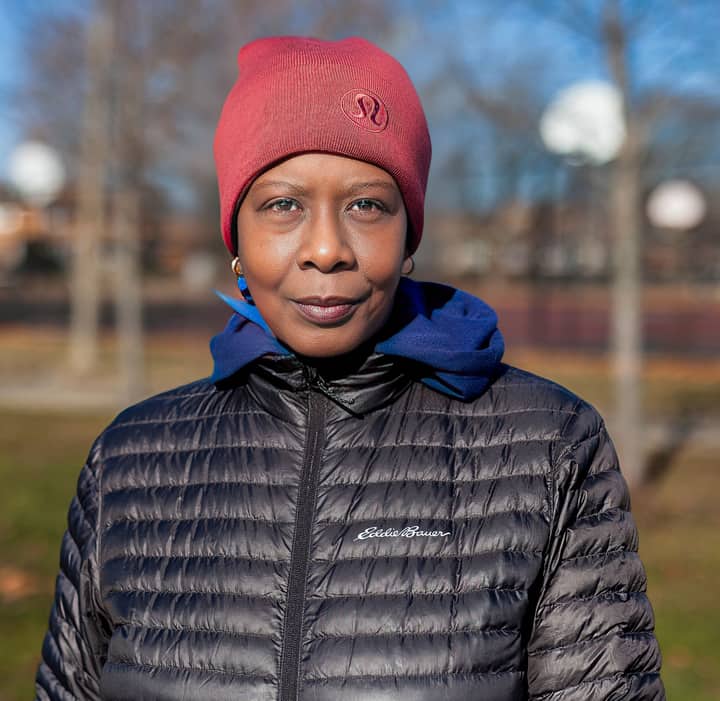 Portrait of a woman in winter attire, Chicago park setting, showcasing fashion.