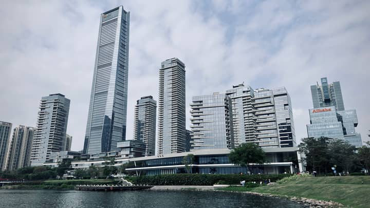 Modern skyscrapers of Shenzhen skyline by the waterfront on a cloudy day.