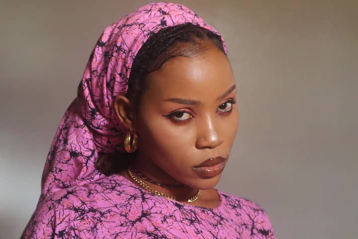 Striking portrait of a woman in fashionable attire in Mombasa, Kenya.