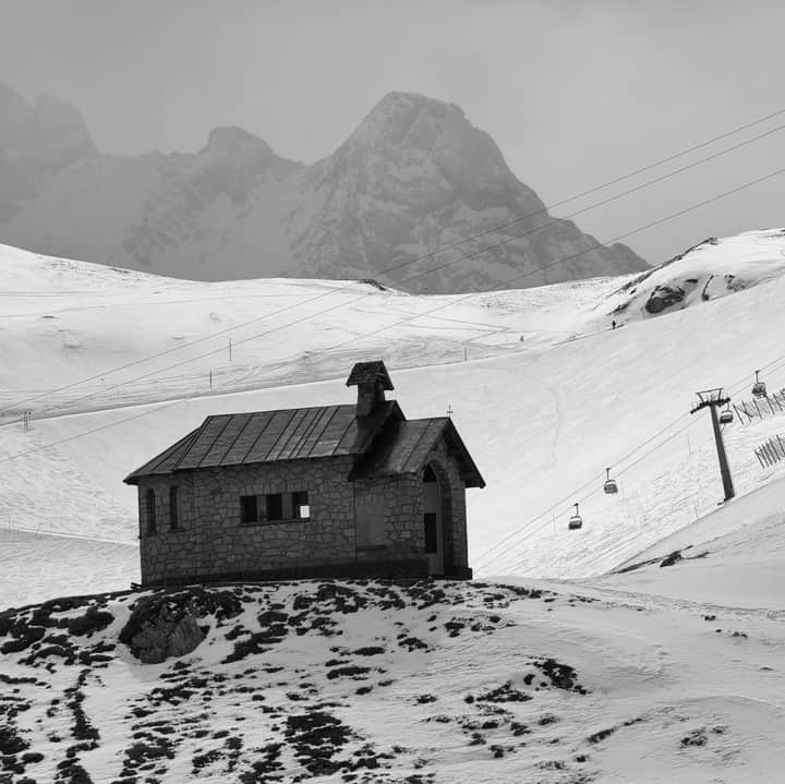 A winter scene of a chapel in the snowy mountains of Trentino-Südtirol, Italy.