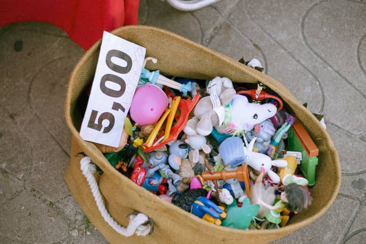A bag of various toys priced at 5.00 euros displayed at a market.