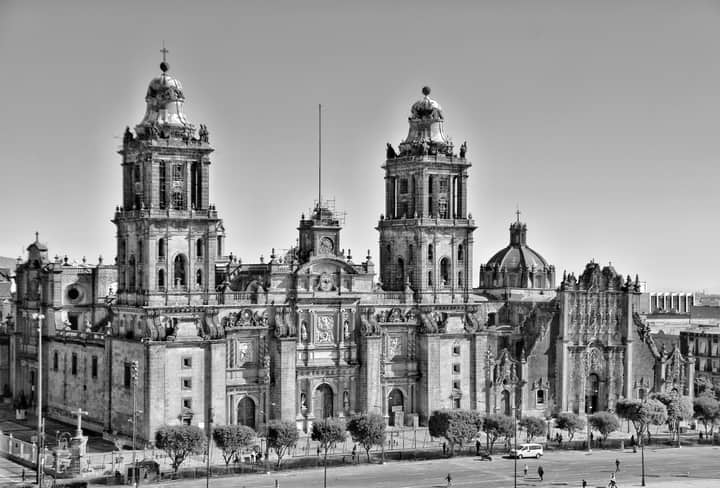 Black and white photo of Mexico City's iconic Metropolitan Cathedral showcasing its rich architectural heritage.