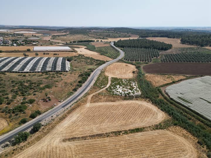 Aerial shot showcasing farmlands and roads in Gefen, Jerusalem District, Israel.