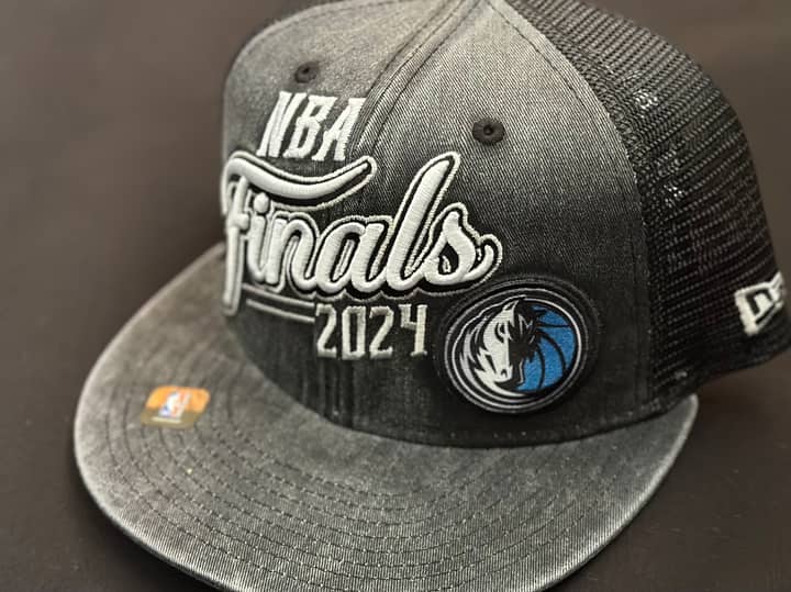 Close-up of a 2024 NBA Finals cap with Dallas Mavericks logo, perfect for sports enthusiasts.