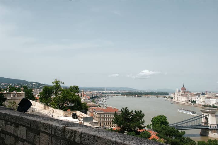 A breathtaking aerial view of Budapest showcases the Danube River and iconic landmarks like the Hungarian Parliament.