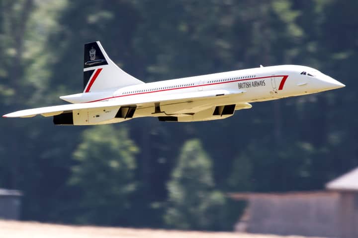 RC model Concorde jet flying outdoors in British Airways livery.