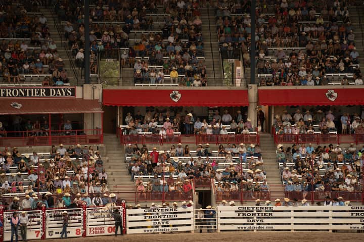 A large crowd enjoys the lively atmosphere at Cheyenne Frontier Days Rodeo in Wyoming.