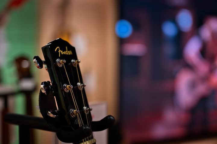 Detailed view of a Fender guitar headstock displayed indoors, Tokyo, Japan.