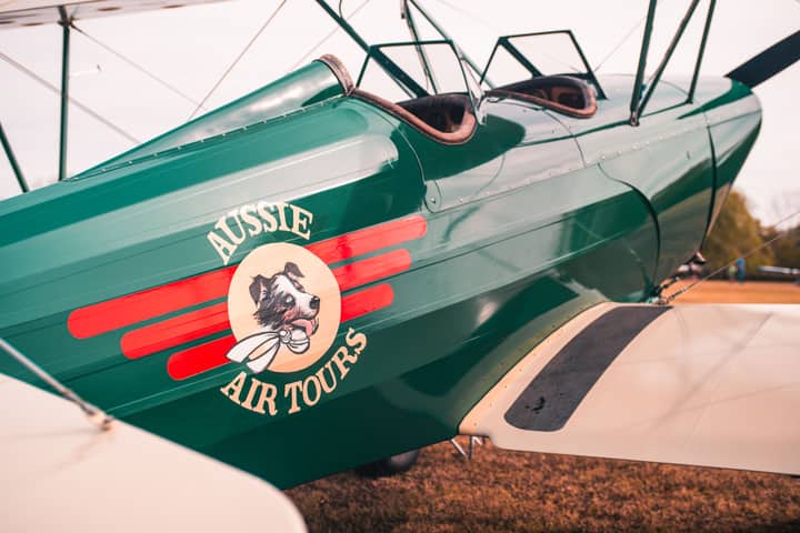 Close-up of a vintage airplane with 'Aussie Air Tours' logo, Collinsville, OK