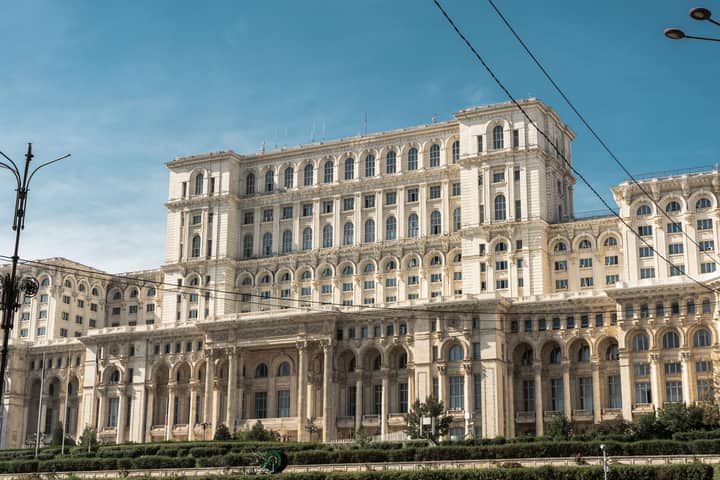 Capture of the iconic Palace of the Parliament in Bucharest, Romania under clear skies.