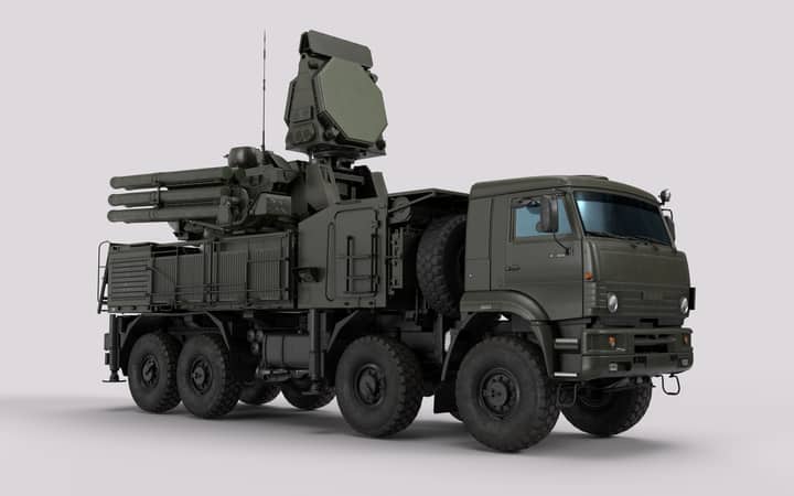 Detailed image of a military vehicle equipped with advanced radar and weaponry systems.