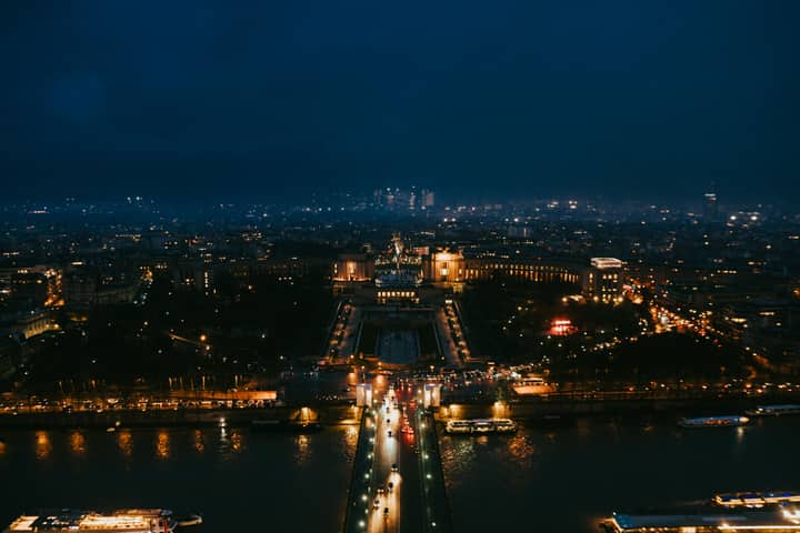 Stunning nighttime aerial cityscape of Paris highlighting iconic landmarks.