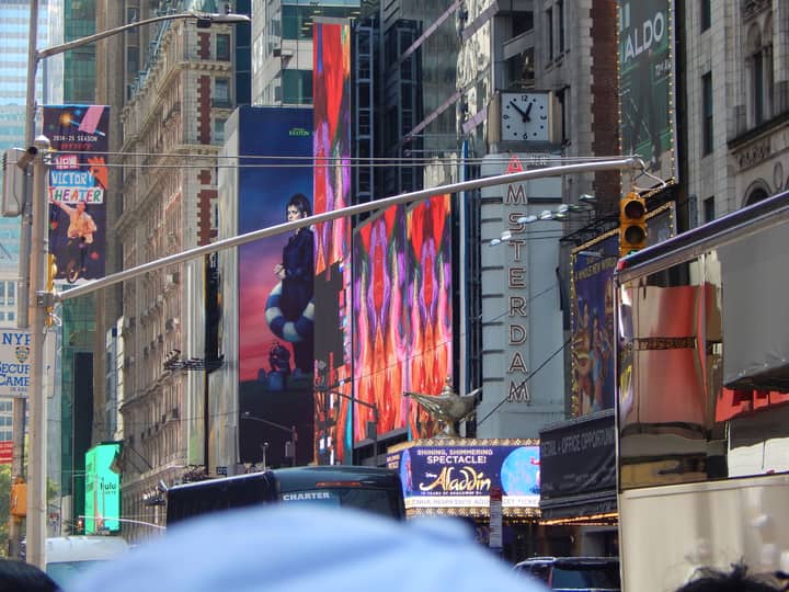 Lively Times Square view showcasing Broadway signs and vibrant street life.