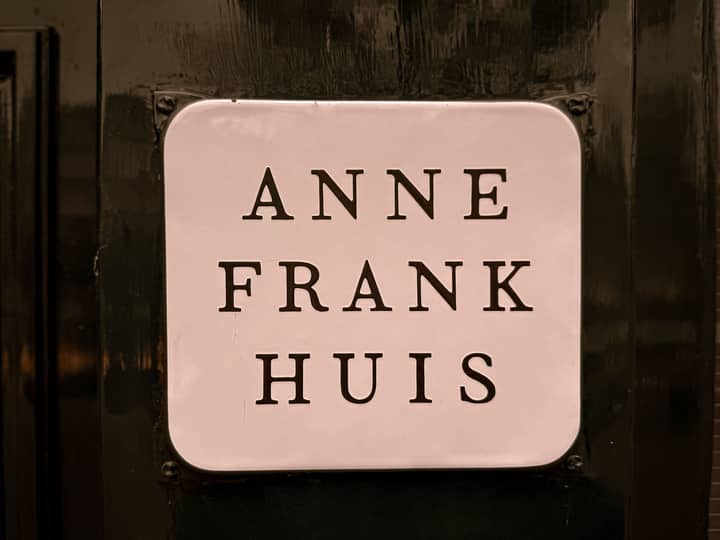 Close-up of the Anne Frank Huis sign in Amsterdam, Netherlands.