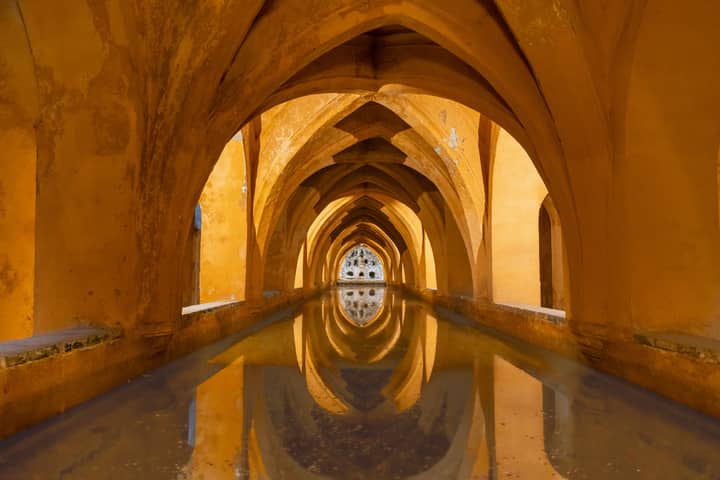 Reflective arches in the Baths of Maria de Padilla, Alcázar of Sevilla.