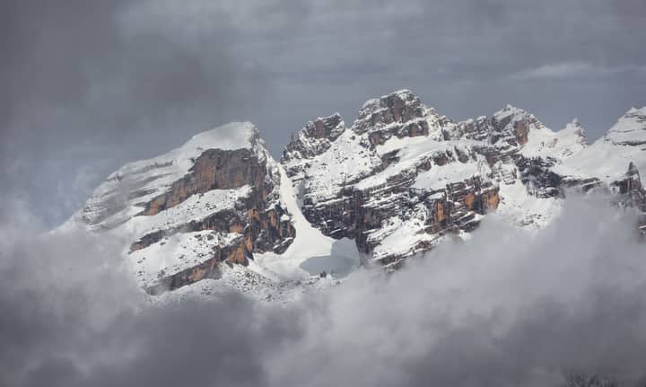 Stunning view of the snow-covered peaks of the Dolomites in Madonna di Campiglio, Italy.