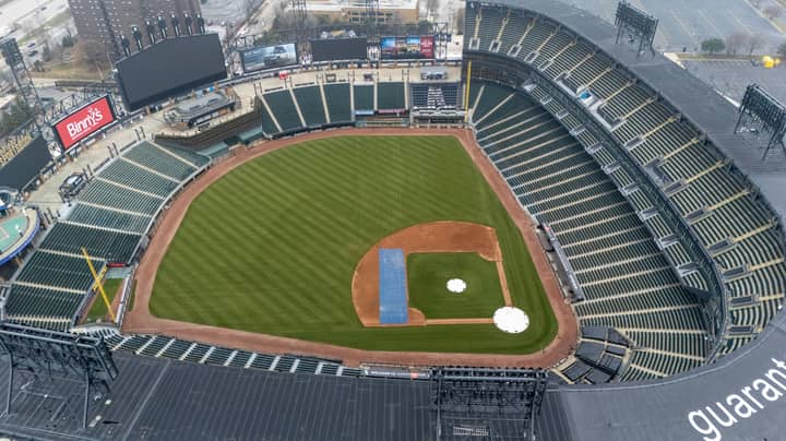 Empty Guaranteed Rate Field in Chicago captured from above, showcasing the lush green baseball field and seating areas.