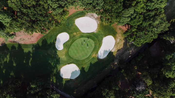 Stunning aerial shot of a lush golf course on Hilton Head Island, showcasing pristine fairways and bunkers.