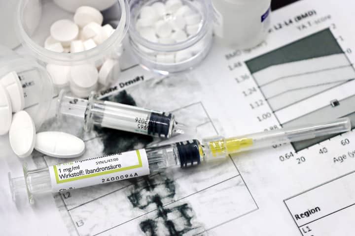 Medical arrangement of osteoporosis treatment tools with injections and pills.